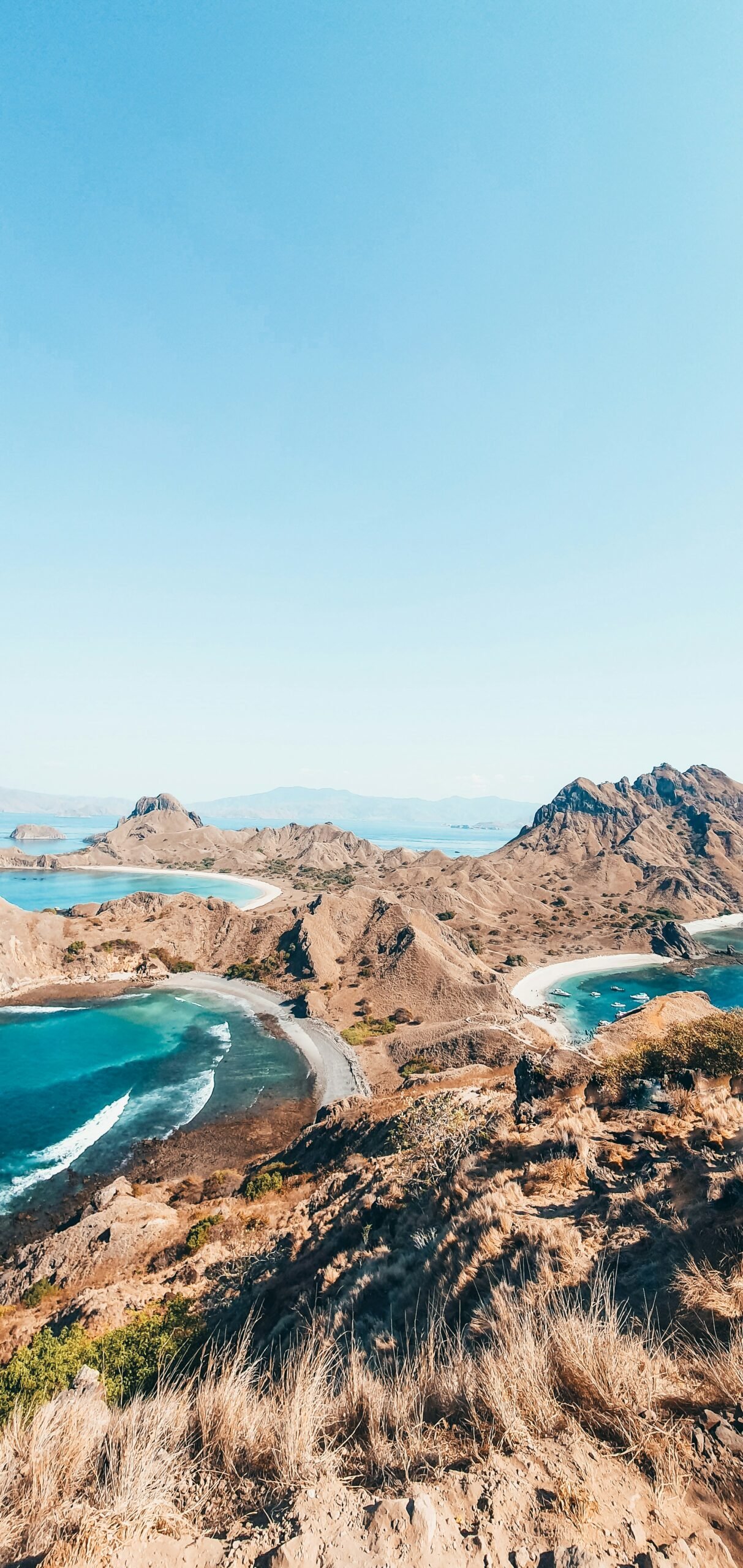 a scenic view of a beach and a body of water