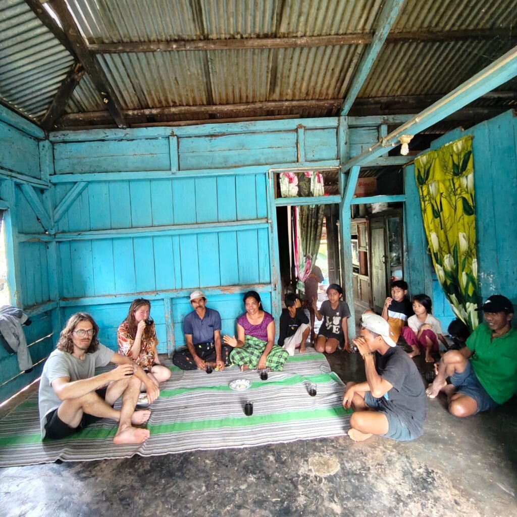 Villagers of Golo Lajang, Flores, gathered for a traditional ceremony, showcasing strong community bonds and cultural togetherness.