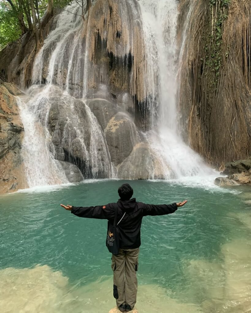 "Cunca Wulang Waterfall – A Hidden Gem of Flores, Indonesia with turquoise pools and jungle cliffs.
