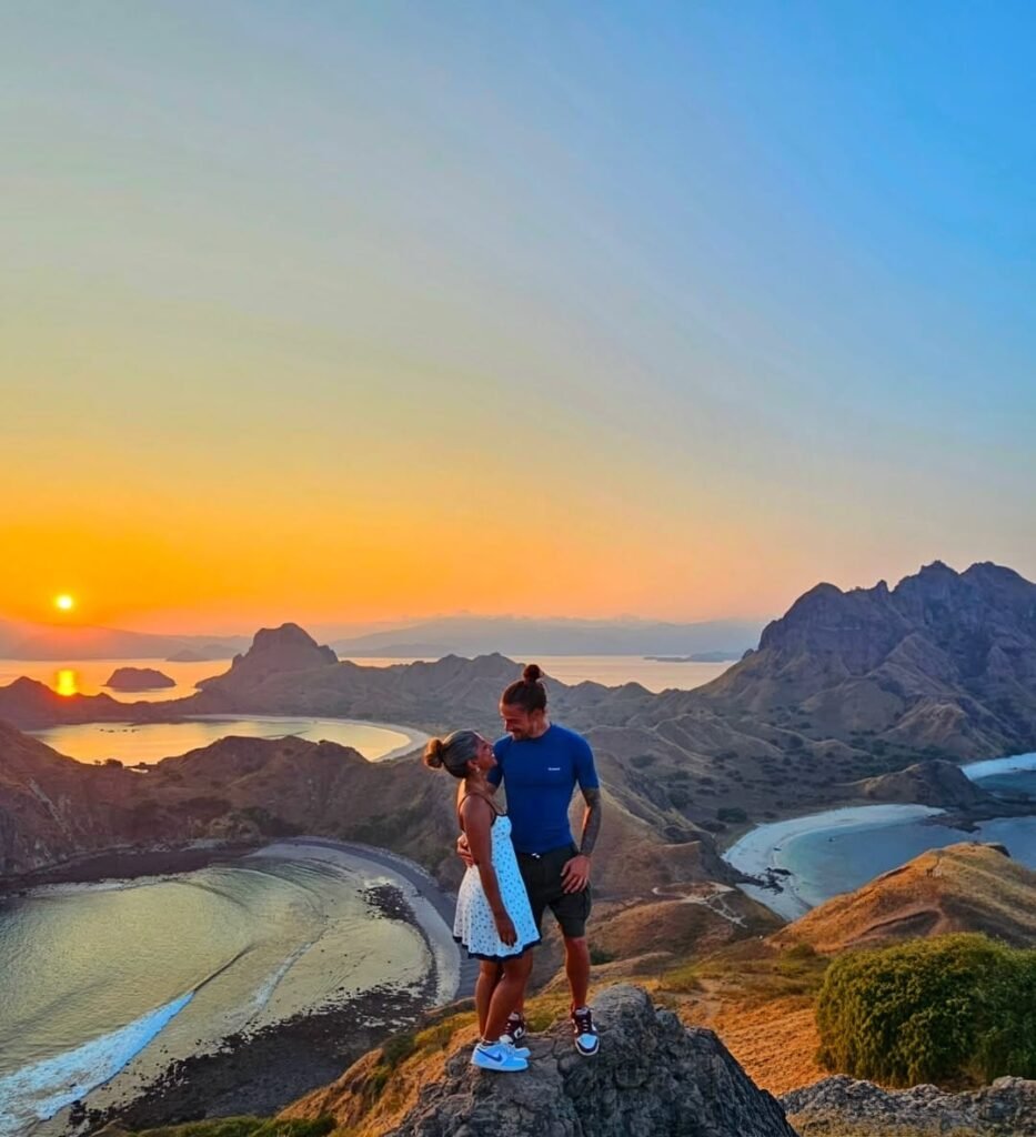 Padar island sunset trekking | flores island indonesia tour komodo tour packages alor tour packages sumba tour lombok & bali tour Tourists hiking up Padar Island during sunset overlooking the dramatic hills and turquoise bays of Komodo National Park