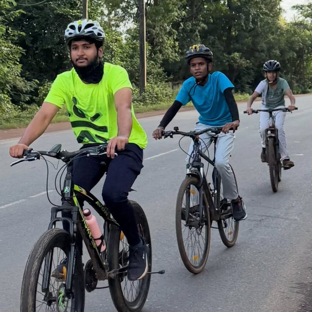 Cyclists riding through scenic highlands during Flores Island Bicycle Tour with Flores Pristine Tour