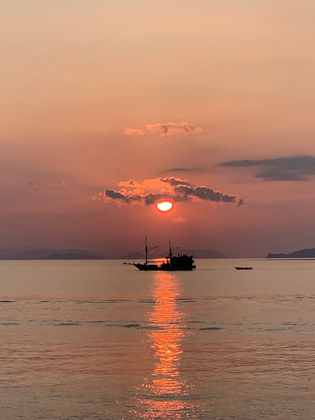 Labuan Bajo sunset scenery with boats and tropical islands