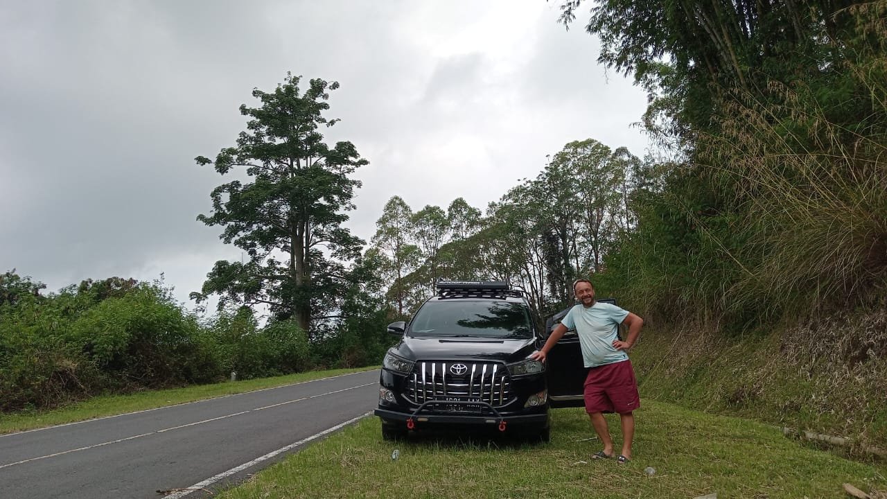 Bajawa car rental with driver | flores komodo tour organizer Bajawa car rental with driver at Avatar Hill Bajawa Flores Indonesia with Toyota Innova Reborn