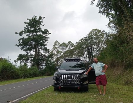 Bajawa car rental with driver at Avatar Hill Bajawa Flores Indonesia with Toyota Innova Reborn