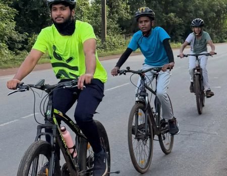 Cyclists riding through scenic highlands during Flores Island Bicycle Tour with Flores Pristine Tour.