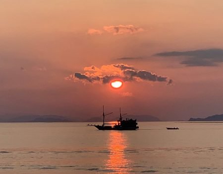 Labuan Bajo sunset scenery with boats and tropical islands