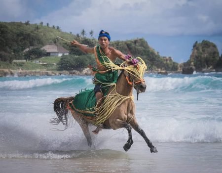 Local People Riding on the Boat-Sumba Tour Packages