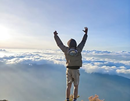 Steep trekking path on Mount Inerie, a volcanic peak in Flores, Indonesia, under a clear sky