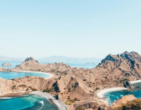 a scenic view of a beach and a body of water